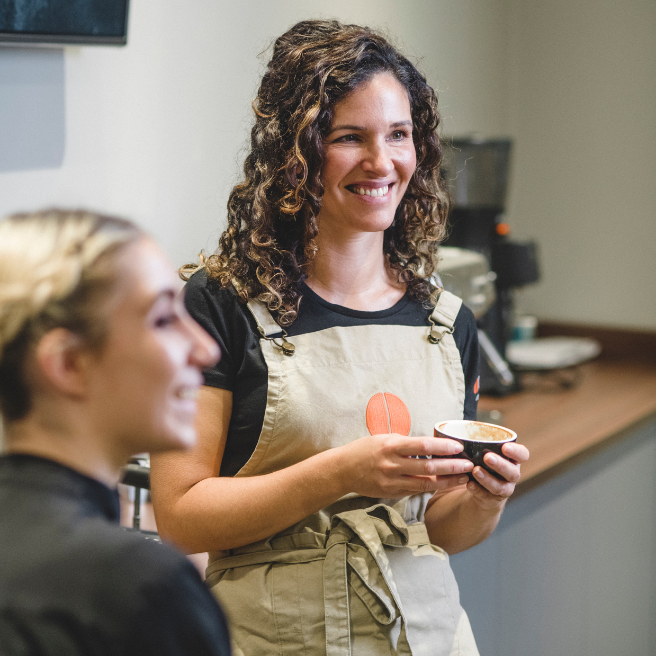 Owens' Head of Training enjoying a coffee in the training room at The Roastery
