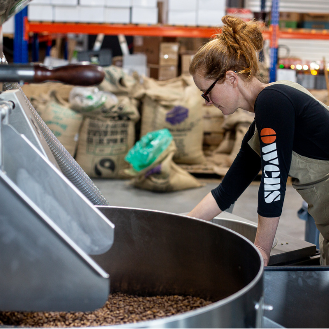 Owens Head of Roasting manually preparing beans for roasting
